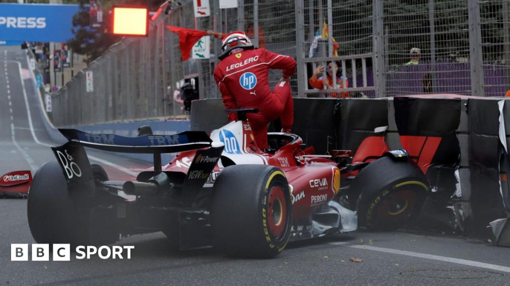 Ferrari's Charles Leclerc climbs out of his car after crashing into the barriers during qualifying for the Azerbaijan Grand Prix