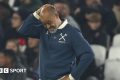 Nuno Espirito Santo looks downwards with his right hand clasped to the top of his head during West Ham's defeat