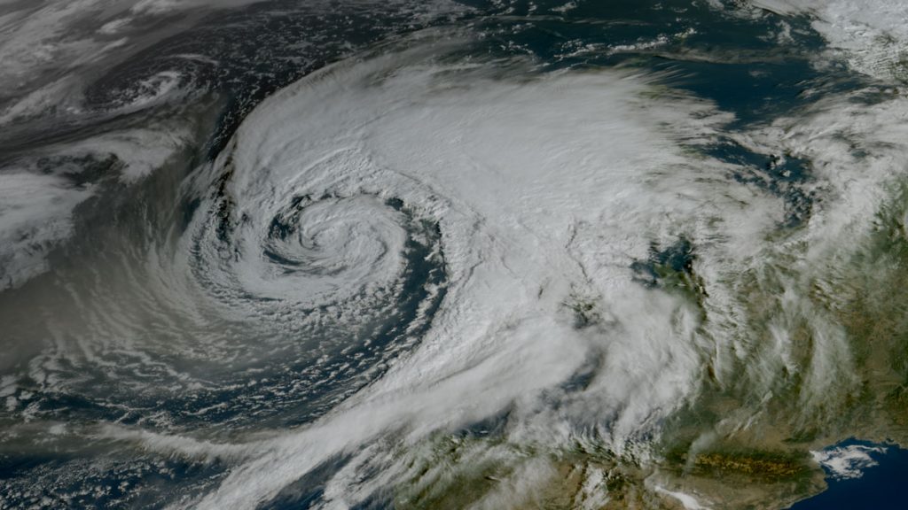 Satellite view of the swirling clouds of a large storm over the Bay of Biscay.
