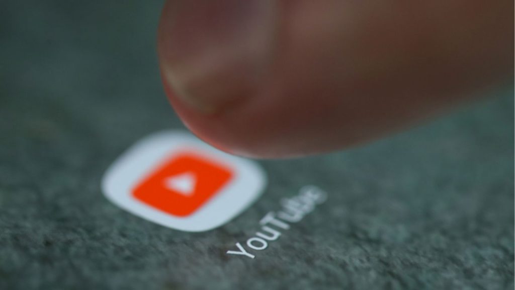 The-YouTube-app-logo-is-seen-on-a-smartphone-in-this-picture-illustration-taken-September-15-2017.-R.jpeg