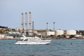 yacht-on-water-near-industrial-refinery-coastal-facility.jpg