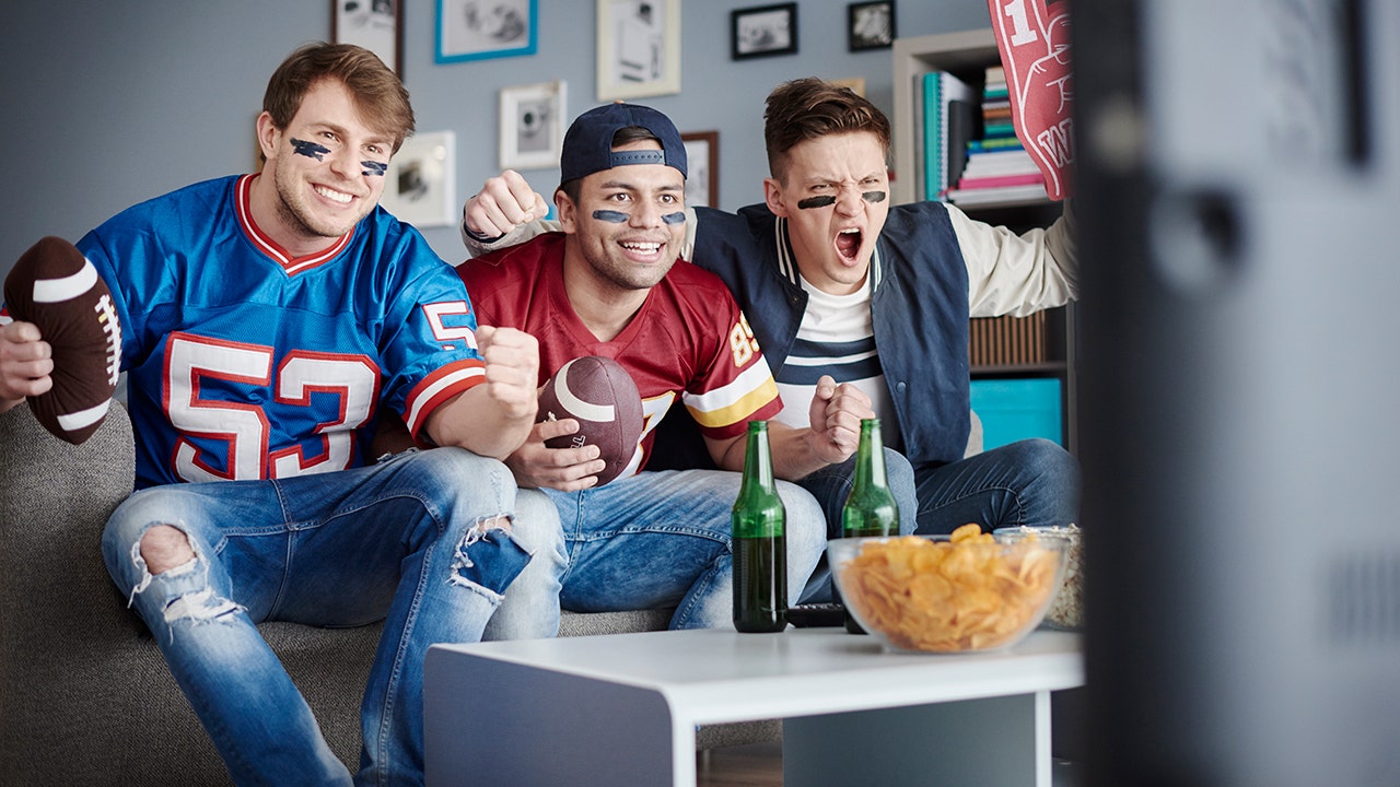 men-watching-football-eating-chips.jpg