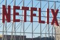 In an aerial view, the Netflix logo is displayed above Netflix corporate offices.